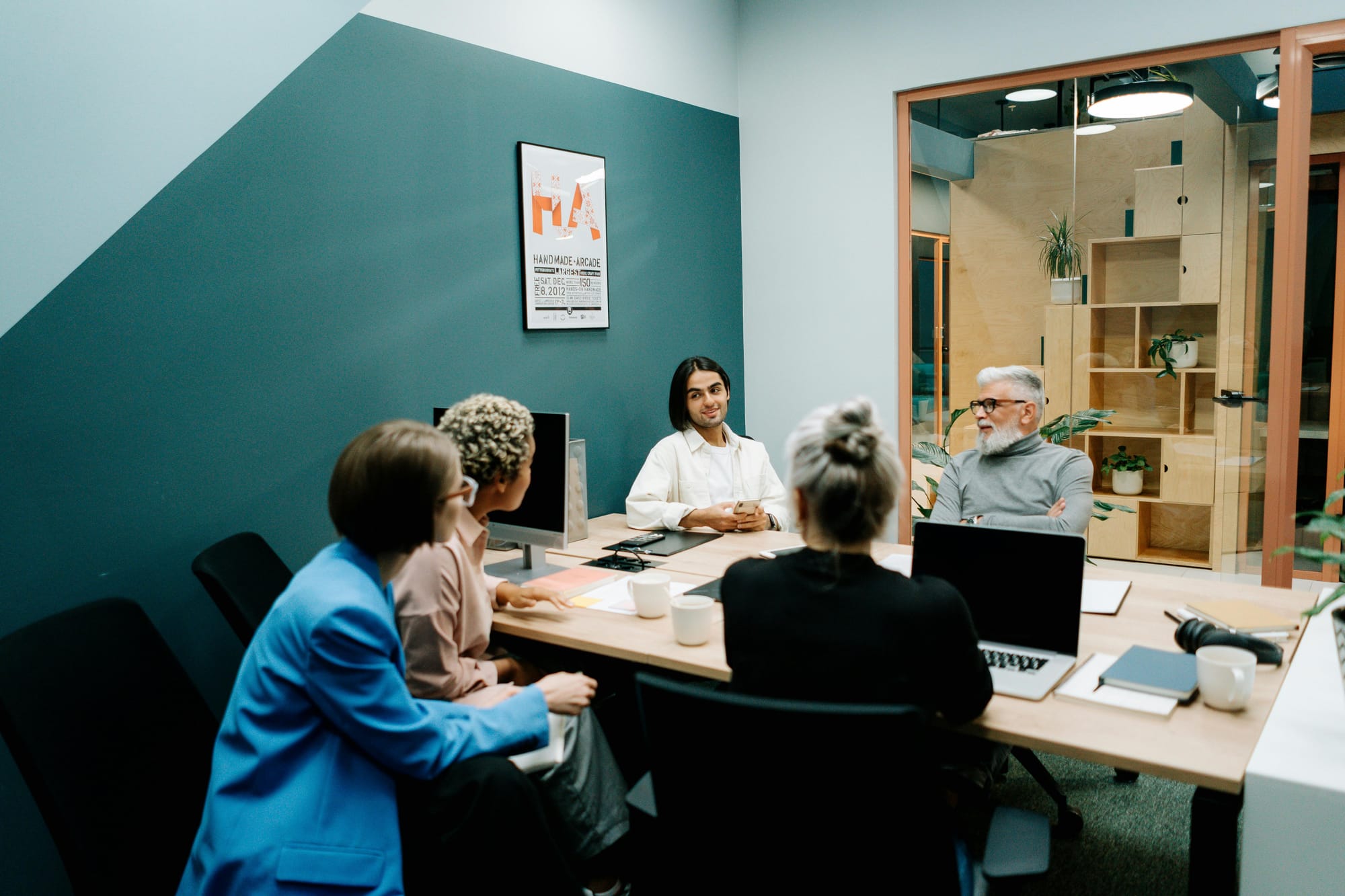 Writers discuss ideas inside a writers' room.